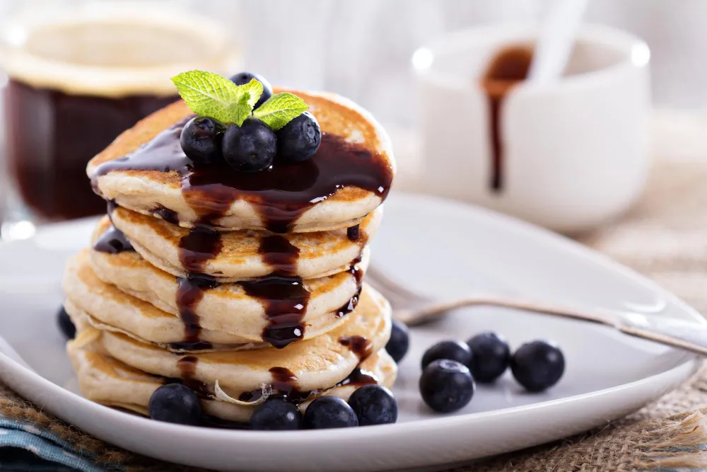 blackberry simple syrup over pancakes